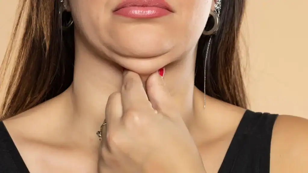 An image of a woman with double chin, sad, worried : Non Surgical Double Chin Removal Treatment in Wootton Bassett, UK