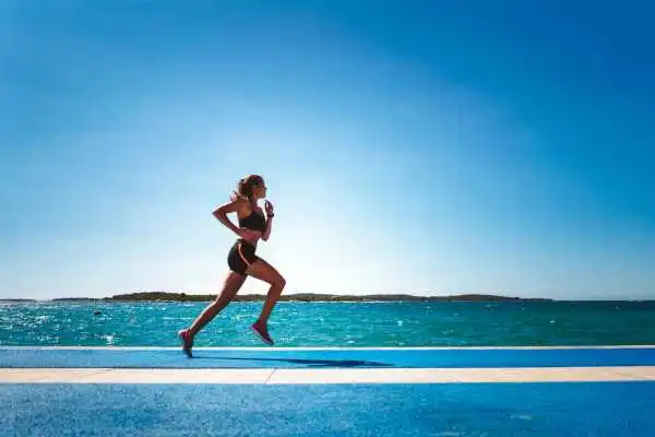 Woman running showing strong leg muscle Wootton Bassett